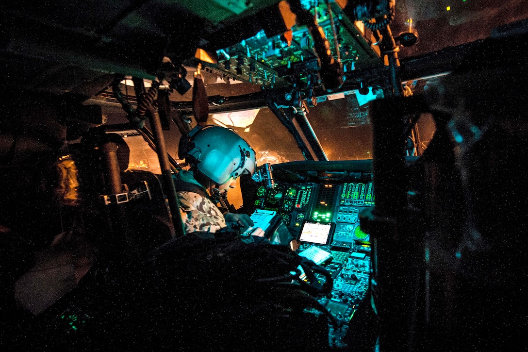 Army pilots complete post-flight checks inside the cockpit of a UH-60 Black Hawk helicopter before taking off during Emerald Warrior 17 at Hurlburt Field, Fla., March 6, 2017. Air Force photo by Staff Sgt. Corey Hook