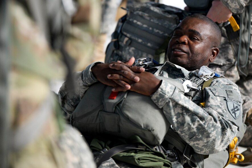 U.S. Army Reserve Sergeant Maj. Dwayne Eaddy, 412th Civil Affairs Battalion command sergeant major, relaxes inside a hangar at Wright-Patterson Air Force Base, Ohio, after putting on his parachute and other gear prior to a jump, March 11, 2017. The 412th Civil Affairs Battalion (Airborne) mobilizes, deploys, plans and conducts civil affairs operations with an orientation to the theater commander. (U.S. Air Force photo by Wesley Farnsworth / Released)