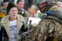 WWII paratrooper James H. “Pee Wee” Martin, one of the last remaining “Toccoa Originals” of 1942, talks with a soldier prior to his jump at Wright-Patterson Air Force Base, Ohio, March 11, 2017.  Martin travels around as a representative of the veterans of the 101st Airborne Division who are no longer here and in an effort to promote and preserve the legacy and lessons of WWII. (U.S. Air Force photo by Wesley Farnsworth / Released)