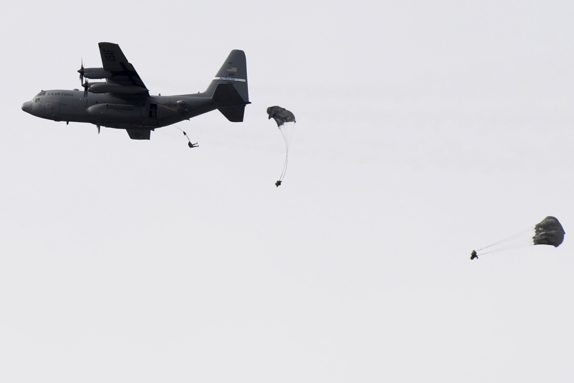 Soldiers with the 412th Civil Affairs Battalion and 346th Psychological Operations Company, based in Whitehall, Ohio, jump from an H model C-130 aircraft from the Air National Guard’s 123rd Airlift Wing in Louisville, Kentucky, over Wright-Patterson Air Force Base, Ohio, March 11, 2017. The soldiers were conducting the jump as part of a joint service training exercise. (U.S. Air Force photo by Wesley Farnsworth / Released)