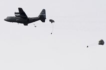 Soldiers with the 412th Civil Affairs Battalion and 346th Psychological Operations Company, based in Whitehall, Ohio, jump from an H model C-130 aircraft from the Air National Guard’s 123rd Airlift Wing in Louisville, Kentucky, over Wright-Patterson Air Force Base, Ohio, March 11, 2017. The soldiers were conducting the jump as part of a joint service training exercise. (U.S. Air Force photo by Wesley Farnsworth / Released)