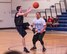 Bryan Wilson, Armament Directorate, passes the ball past Santos Padilla, 53rd Wing, during the intramural basketball championship March 6 at Eglin Air Force Base Fla. The EB team defeated the 53rd Wing team 53-42 to take the trophy. (U.S. Air Force photo/Ilka Cole) 