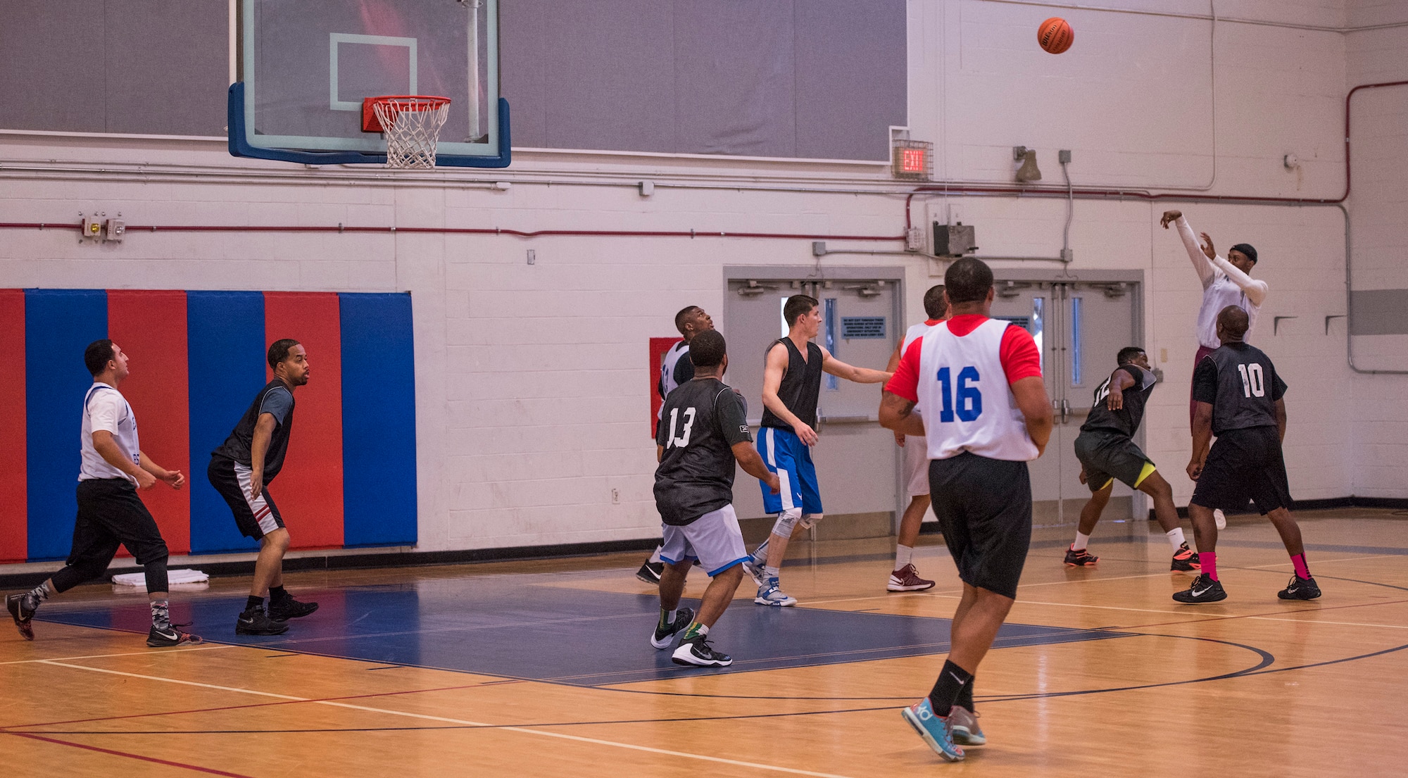 A 53rd Wing competitor shoots a two-point basket during the intramural basketball championship March 6 at Eglin Air Force Base Fla. The EB team defeated the 53rd Wing team 53-42 to take the trophy. (U.S. Air Force photo/Ilka Cole) 