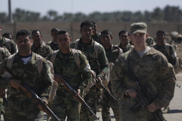 Iraqi soldiers enrolled in the Iraqi Ranger course conduct a road march under the supervision of U.S. Army Soldiers with 1st Battalion, 32nd Infantry Regiment, 1st Brigade Combat Team, 10th Mountain Division, at Camp Taji, Iraq, March 7, 2016. The Iraqi Ranger course is an advanced infantry fighting school established to help train special operations soldiers for the Iraqi Army.  The United States and the Iraqi government will continue to work together on their shared goal of defeating the Islamic State of Iraq and the Levant and training a professional national security force that can protect all the Iraqi people against extremist threats. (U.S. Army photo by Sgt. Paul Sale/Released)