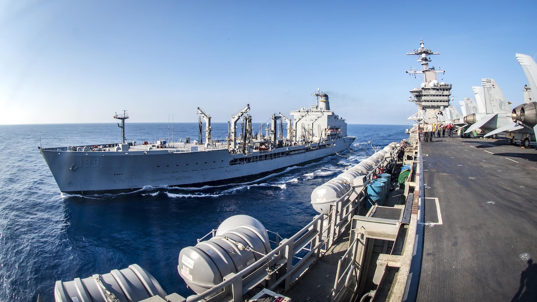 The aircraft carrier USS Carl Vinson conducts a replenishment at sea with the fleet replenishment oiler USNS Tippecanoe in the South China Sea, March 5, 2017. Navy photo by Petty Officer 2nd Class Sean M. Castellan