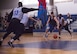 David Adler, Armament Directorate and a 53rd Wing competitor, race toward the ball during the intramural basketball championship March 6 at Eglin Air Force Base Fla. The EB team defeated the 53rd Wing team 53-42 to take the trophy. (U.S. Air Force photo/Ilka Cole) 