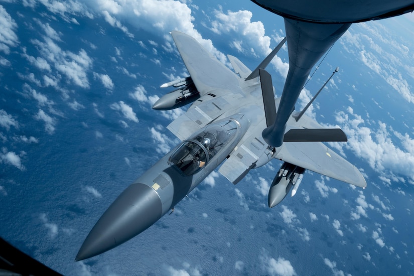 A U.S. Air Force F-15 Eagle from the 67th Fighter Squadron receives an inflight refuel from a KC-135 Stratotanker from the 909th Air Refueling Squadron March 6, 2017, en route to Kadena Air Base, Japan. Both Squadrons returned to Kadena after spending three weeks training with Australian and Japanese partners for exercise Cope North at Andersen Air Force Base, Guam. During the exercise, the 909th ARS flew 23 sorties and offloaded more than 1.1 million pounds of fuel to 180 receivers. (U.S. Air Force photo by Senior Airman John Linzmeier)