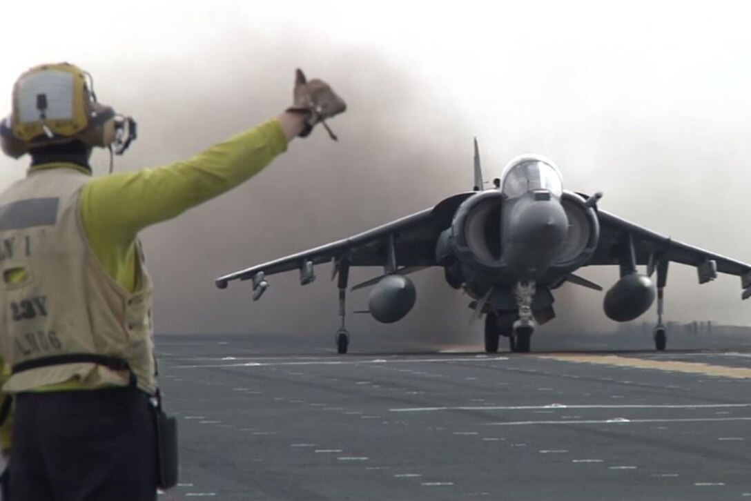 A fighter jet prepares to take off from the flight deck of the amphibious assault ship USS Bonhomme Richard while on a routine patrol in the 7th Fleet area of operations. Screen shot from video by Cpl. Jack Gnosca

