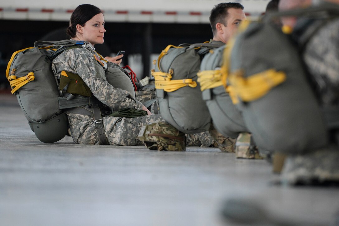 U.S. Army Reserve 1st Lt. Jackie Bradford, 412th Civil Affairs Battalion delta company team chief, rests with other soldiers while waiting to board one of two C-130 aircraft which will take them up to conduct a jump at Wright-Patterson Air Force Base, Ohio, as part of a joint service training exercise, March 11, 2017. The 412th Civil Affairs Battalion (Airborne) mobilizes, deploys, plans and conducts civil affairs operations with an orientation to the theater commander.