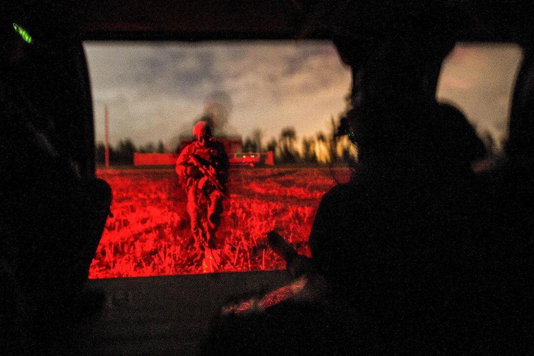 A soldier walks toward a UH-60 Black Hawk helicopter for extraction during Emerald Warrior 17 at Hurlburt Field, Fla., March 6, 2017. The U.S. Special Operations Command exercise focuses on joint special operations forces as they train to respond to various threats across the spectrum of conflict. Air Force photo by Staff Sgt. Corey Hook