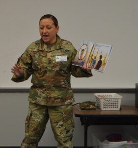 U.S. Army Reserve Master Sgt. Johnnie Garcia with the 4th Sustainment Command (Expeditionary) reads “Hero Mom” to students at Kinder Ranch Elementary in San Antonio, TX, Mar. 10, 2017. 