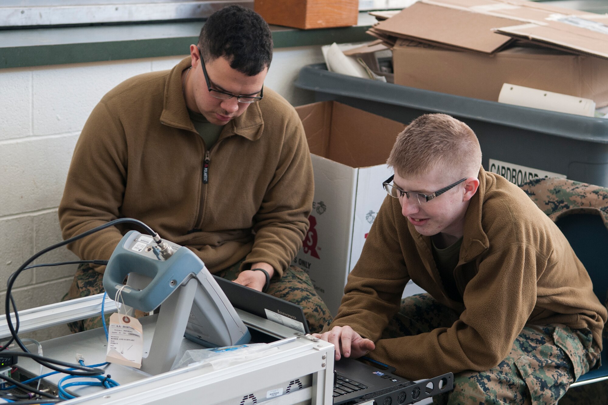 Lance Cpl. Noah Hannon-Childers and Lance Cpl. Blake Whitson, Detachment 1, Communications Company, 4th Marine Logistics Group cyber network operators, track a communications satellite on March 5, 2017 at Grissom Air Reserve Base, Ind. The two Marines were setting up a communications link with their home unit during a weeklong training exercise. (U.S. Air Force photo/Staff Sgt. Dakota Bergl)
