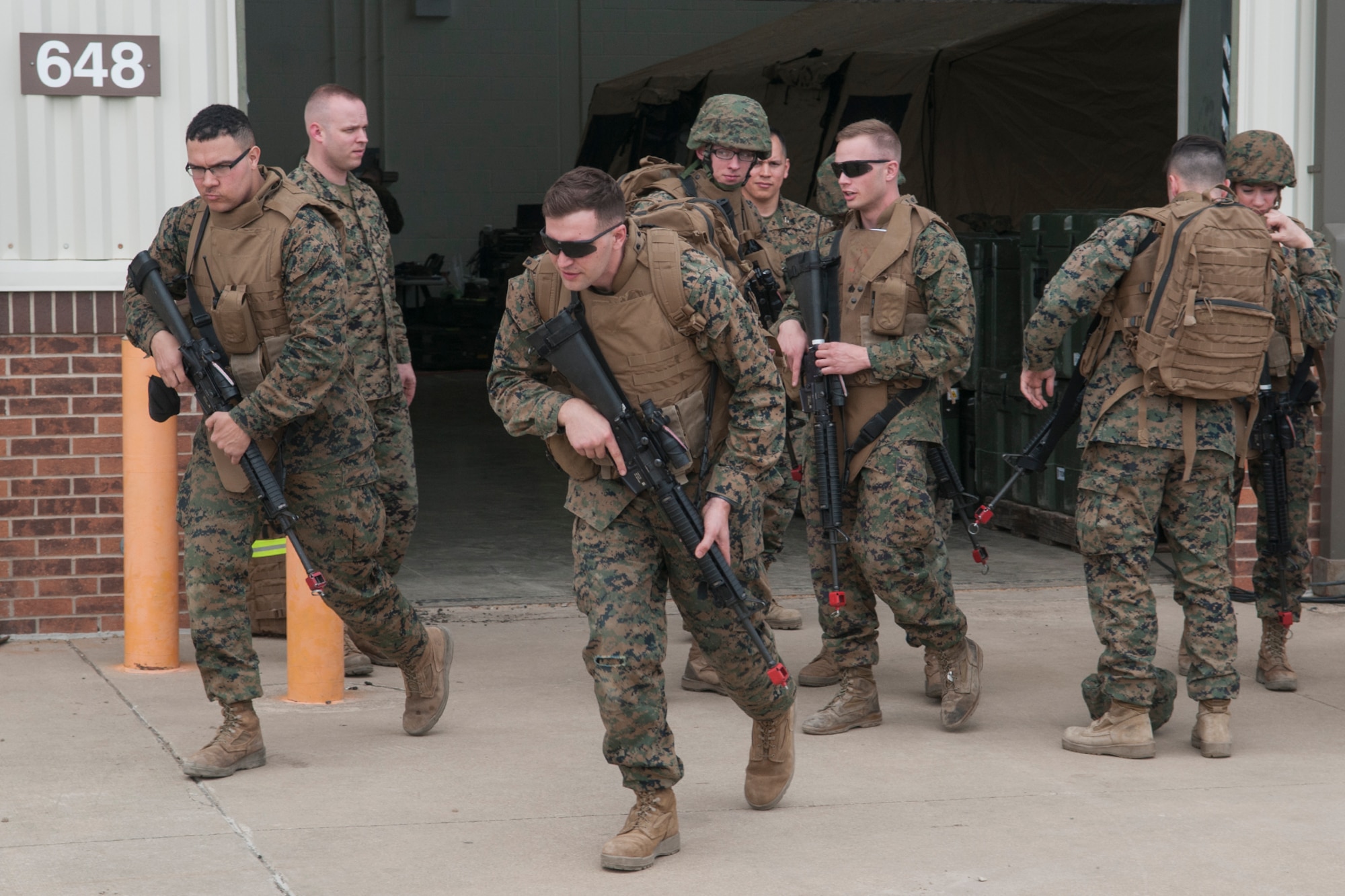 Lance Cpl. Noah Hannon-Childers and Lance Cpl. Kyle Fisher, Detachment 1, Communications Company, 4th Marine Logistics Group cyber network operators, break away from their squad before a simulated patrol at Grissom Air Reserve Base, Ind. on March 9, 2017. The Marines ran the patrol as part of a weeklong training exercise. (U.S. Air Force photo/Staff Sgt. Dakota Bergl)