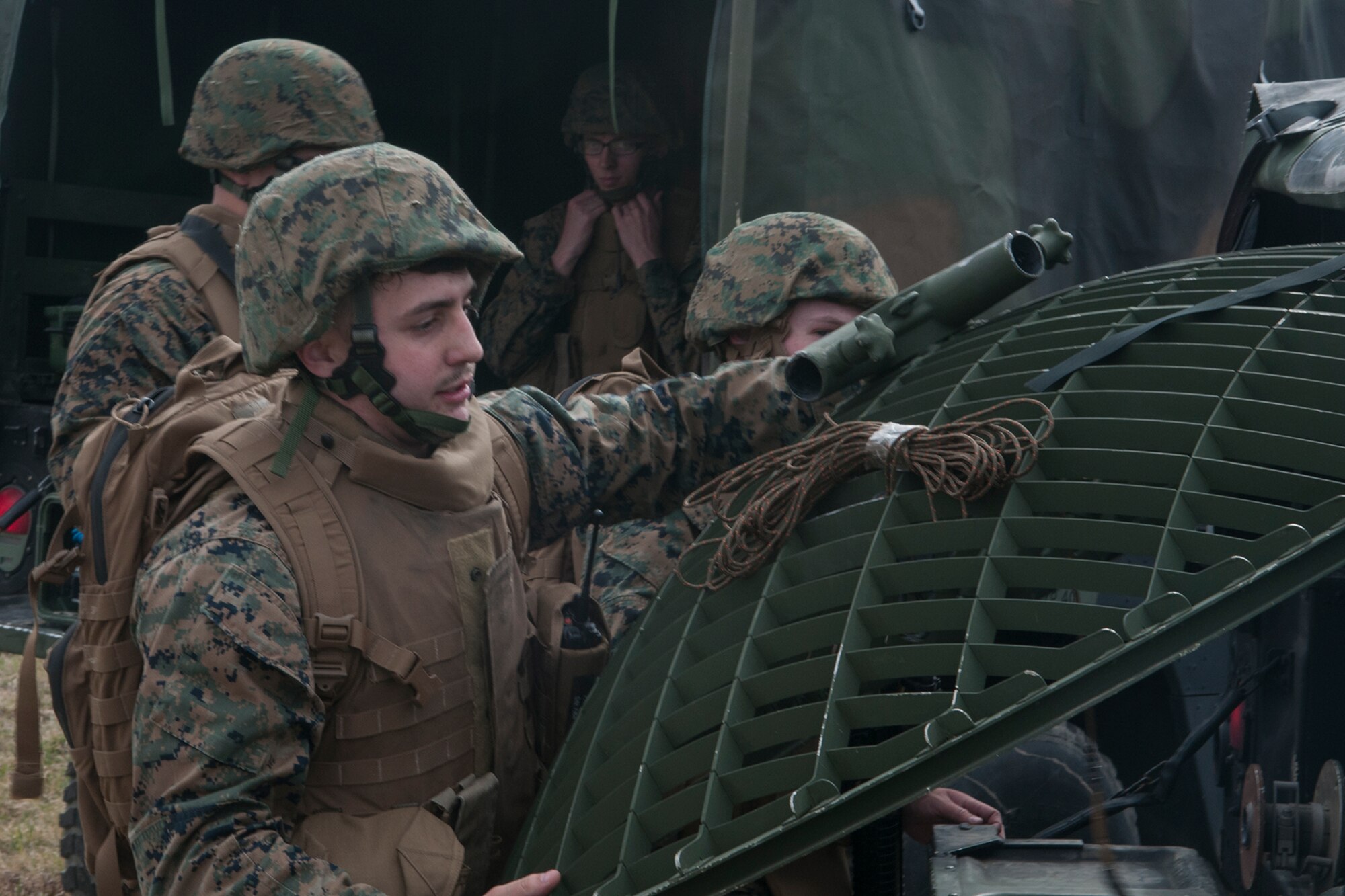 Lance Cpl. Matt Moats, Detachment 1, Communications Company, 4th Marine Logistics Group field wireman, unloads communications equipment from a transport vehicle at Grissom Air Reserve Base, Ind. on March 9, 2017. The equipment was used to set up a mobile communications center as part of a training exercise. (U.S. Air Force photo/Staff Sgt. Dakota Bergl)