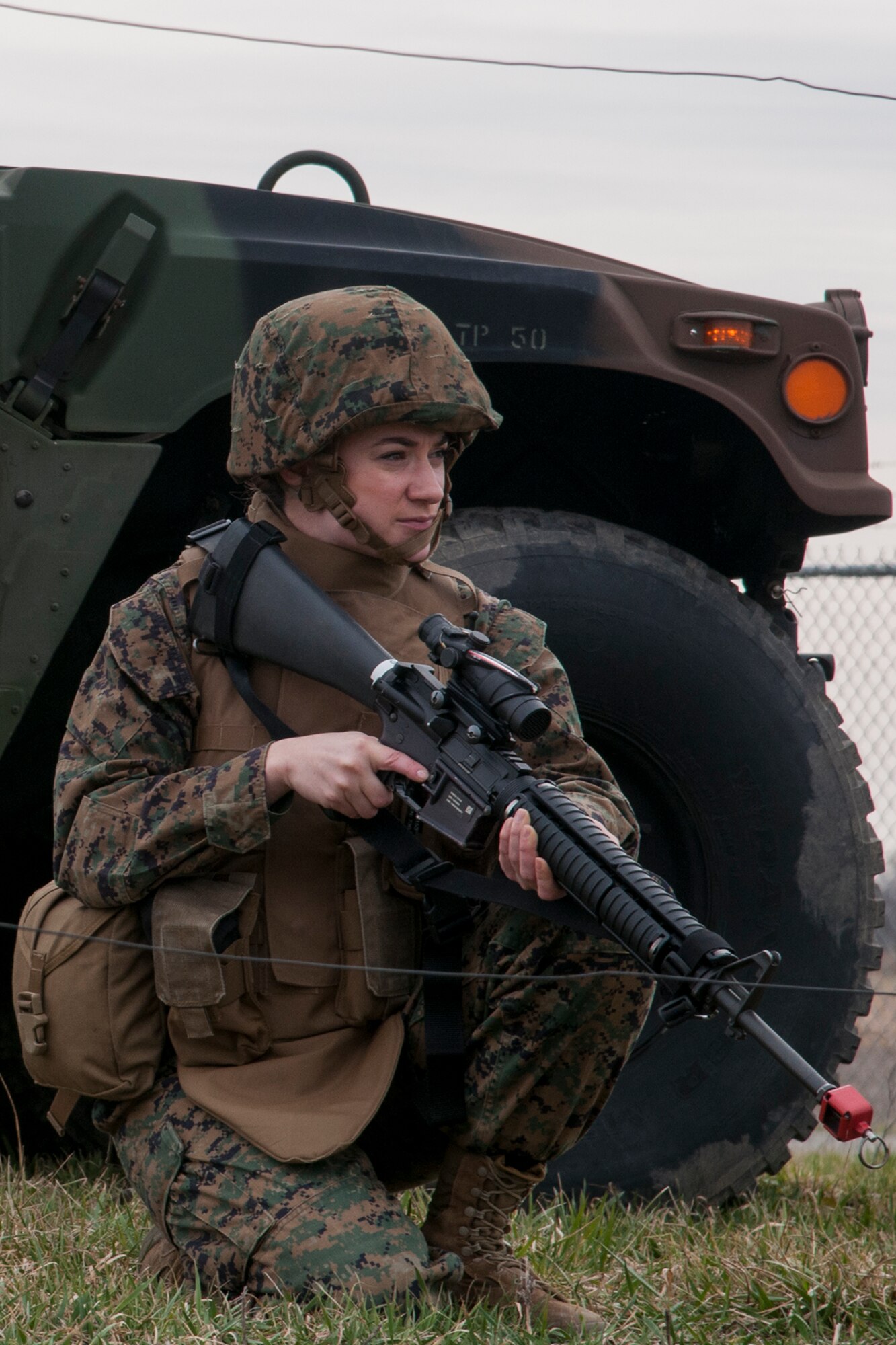 Sgt. Rachel Mahan, Detachment 1, Communications Company, 4th Marine Logistics Group field wireman, keeps a lookout for danger during a simulated patrol at Grissom Air Reserve Base, Ind. on March 9, 2017. The patrol stopped at several checkpoints before setting up a mobile communications center. (U.S. Air Force photo/Staff Sgt. Dakota Bergl)