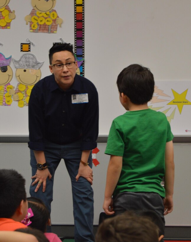 Cristela Trevino, Child and Youth Services Command Specialist with the 4th Sustainment Command (Expeditionary), speaks with students at Kinder Ranch Elementary in San Antonio, TX, about how they can be real life heroes on Mar. 10, 2017. 