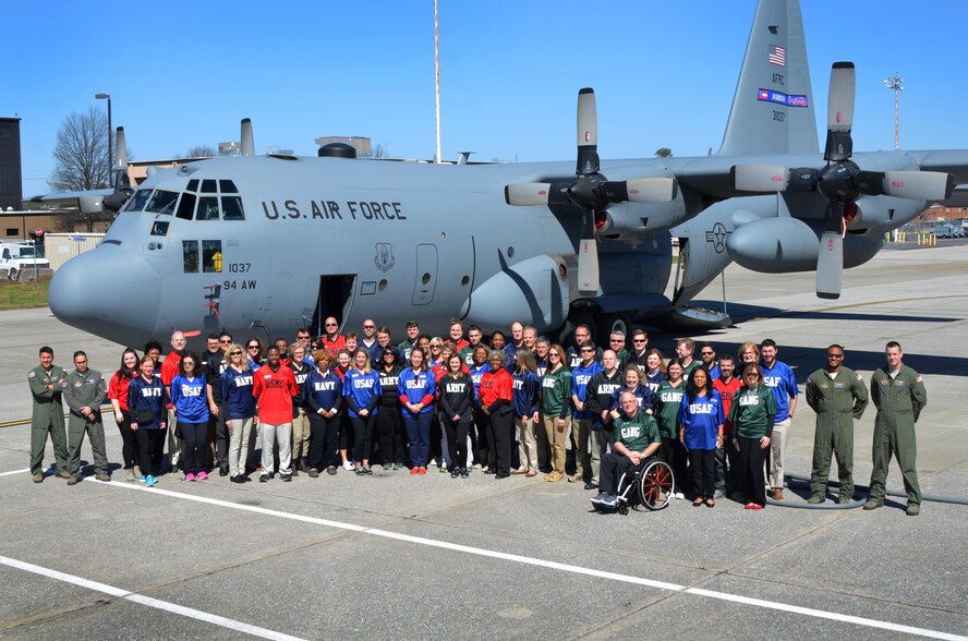 Members of Leadership Cobb stand in front of C-130 Hercules aircraft during tour of Dobbins Air Reserve Base March 8, 2017. The LC group spoke to crewmembers and toured the flight deck. (U.S. Air Force photo by Senior Airman Lauren Douglas)