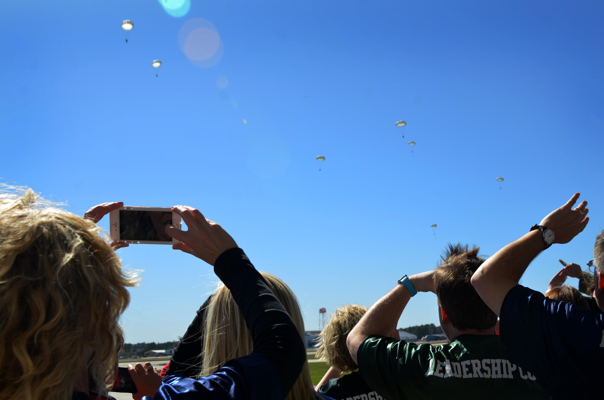 The Leadership Cobb group was taken to an observation deck to view a local training mission with two air drops at Dobbins Air Reserve Base, March 8, 2017. The group witnessed a cargo drop and personnel drop of eight Army National Guard soldiers. (U.S. Air Force photo by Senior Airman Lauren Douglas)