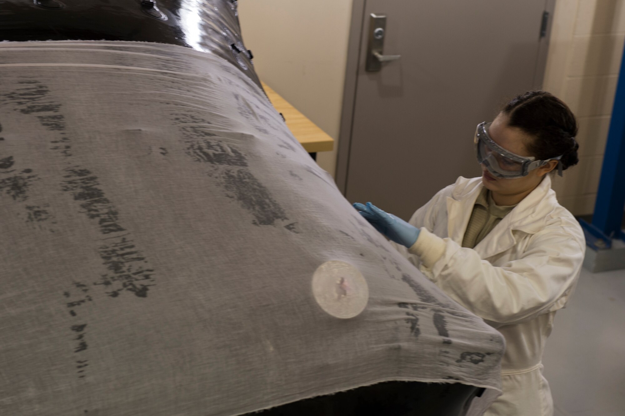 Airman 1st Class Kameron Utira-Ramirez, 434th Maintenance Squadron aircraft fuels system mechanic, inspects a KC-135R Stratotanker fuel bladder for leaks at Grissom Air Reserve Base, Ind. on Feb. 14, 2017. The fuel bladders are removed from the aircraft, inflated and coated with a special chemical solution in order to identify leaks. (U.S. Air Force photo/Senior Airman Harrison Witherow)