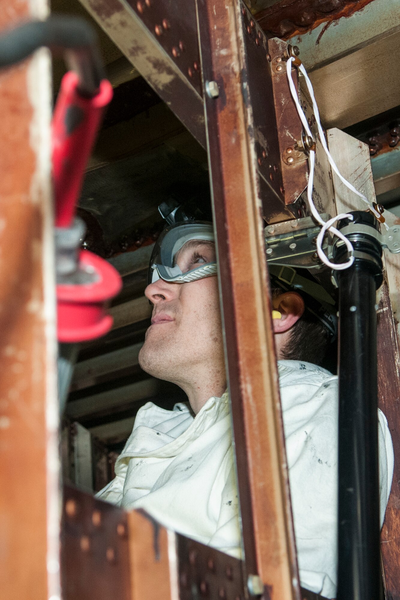Staff Sgt. Kevin Peters, 434th Maintenance Squadron aircraft fuels system mechanic, inspects the interior of a fuel tank on March 7, 2017 at Grissom Air Reserve Base, Ind. Airmen are occasionally required to enter the fuel tanks to search for leaks. (U.S. Air Force photo/Staff Sgt. Dakota Bergl)