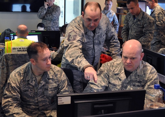 Master Sgt. Chuck Sexton, Superintendent of the 910th Emergency Management (EM) Flight, assists members of the 910th Fire Department during a table top exercise held on March, 4, 2017, here. EM holds regular exercises and scenarios to ensure and improve readiness among base personnel. (U.S. Air Force photo/Senior Airman Joshua Kincaid)