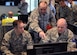 Master Sgt. Chuck Sexton, Superintendent of the 910th Emergency Management (EM) Flight, assists members of the 910th Fire Department during a table top exercise held on March, 4, 2017, here. EM holds regular exercises and scenarios to ensure and improve readiness among base personnel. (U.S. Air Force photo/Senior Airman Joshua Kincaid)