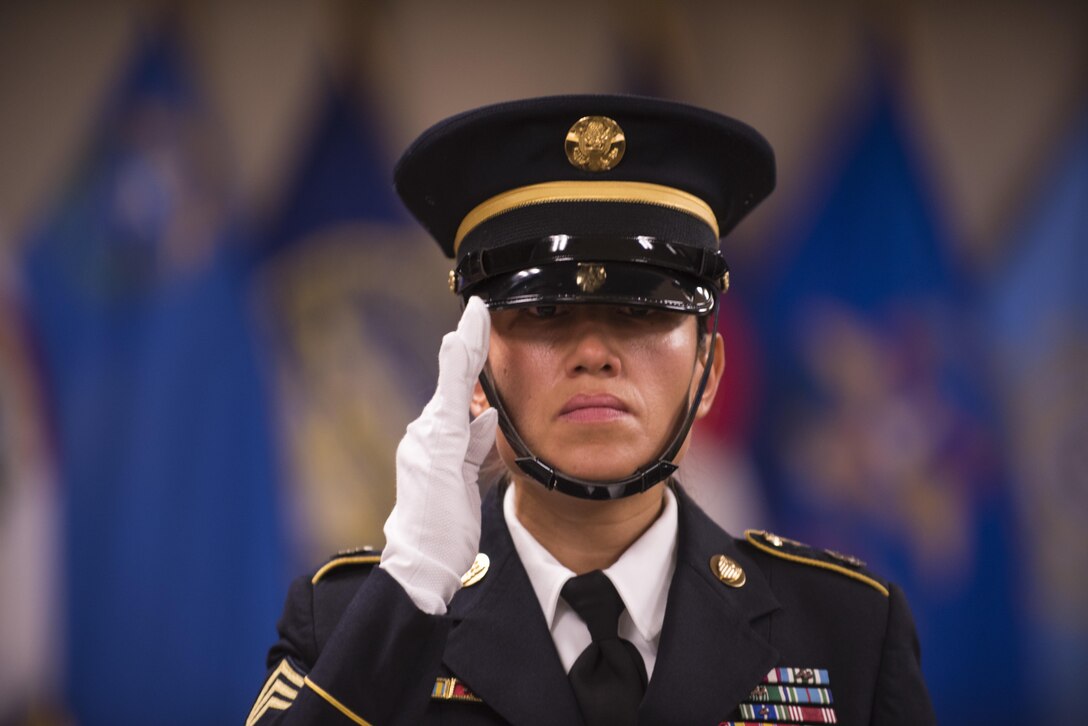 Sgt. 1st Class Joanna Carter, U.S. Army Human Resources Command, renders a hand salute during the final portion of a phase II appearance board at Fort Knox, Ky., Mar. 10. Carter was one of five Soldiers competing for a spot on the unit's Honor Guard team. During the selection board Soldiers were asked questions on topics ranging from Military history to funeral honors. They were also asked to perform ceremonial facing movements they would use during various events.(U.S. Army photo by Sgt. 1st Class Brian Hamilton/released)