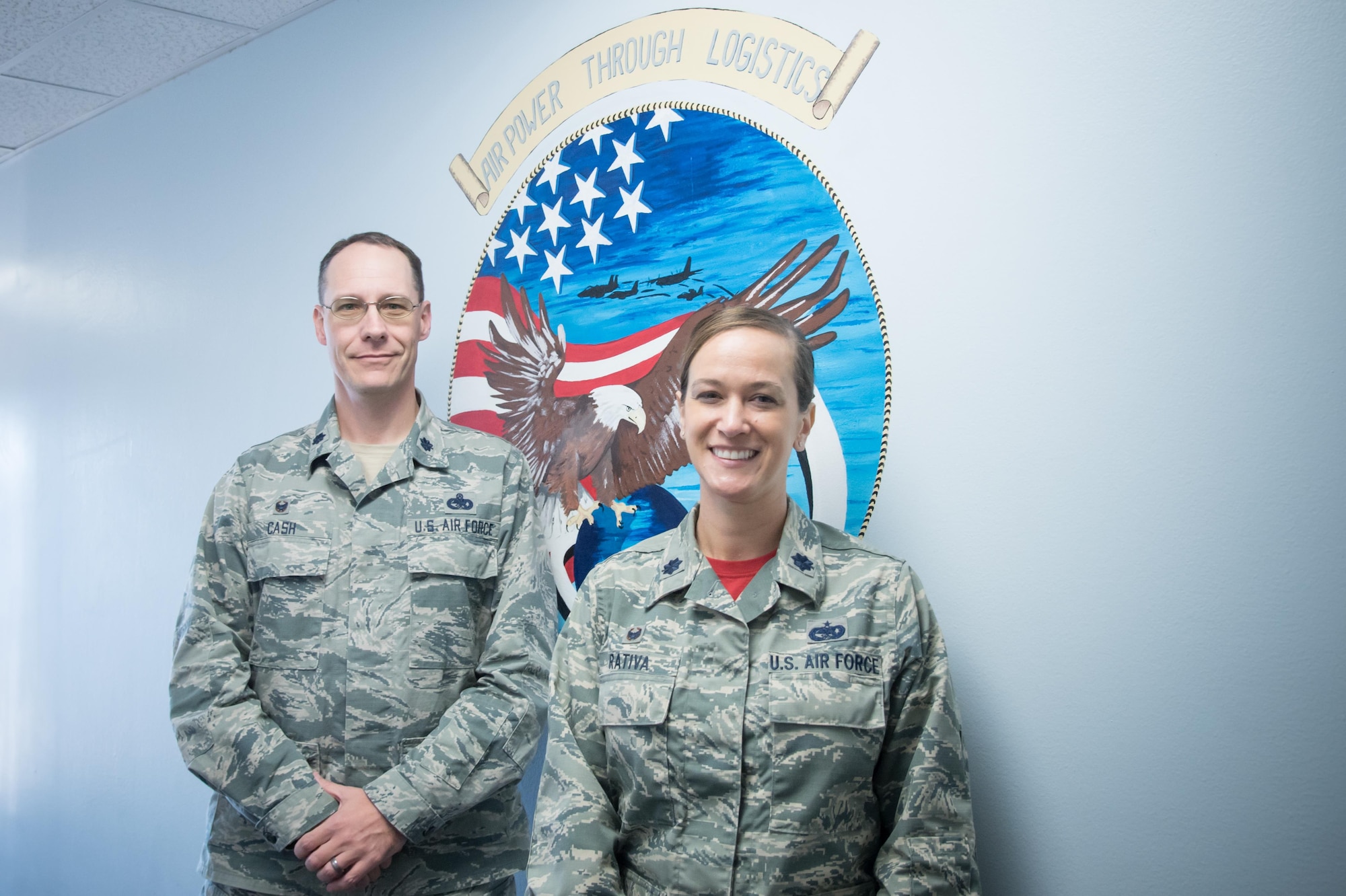 Lt. Col. Clinton Cash, 403rd Logistics Readiness Squadron commander and Lt. Col. Melissa Rativa, 81st LRS commander, pose for a photo March 2 at the Taylor Logistics Center on Keesler Air Force Base, Mississippi. (U.S. Air Force photo/Staff Sgt. Heather Heiney)