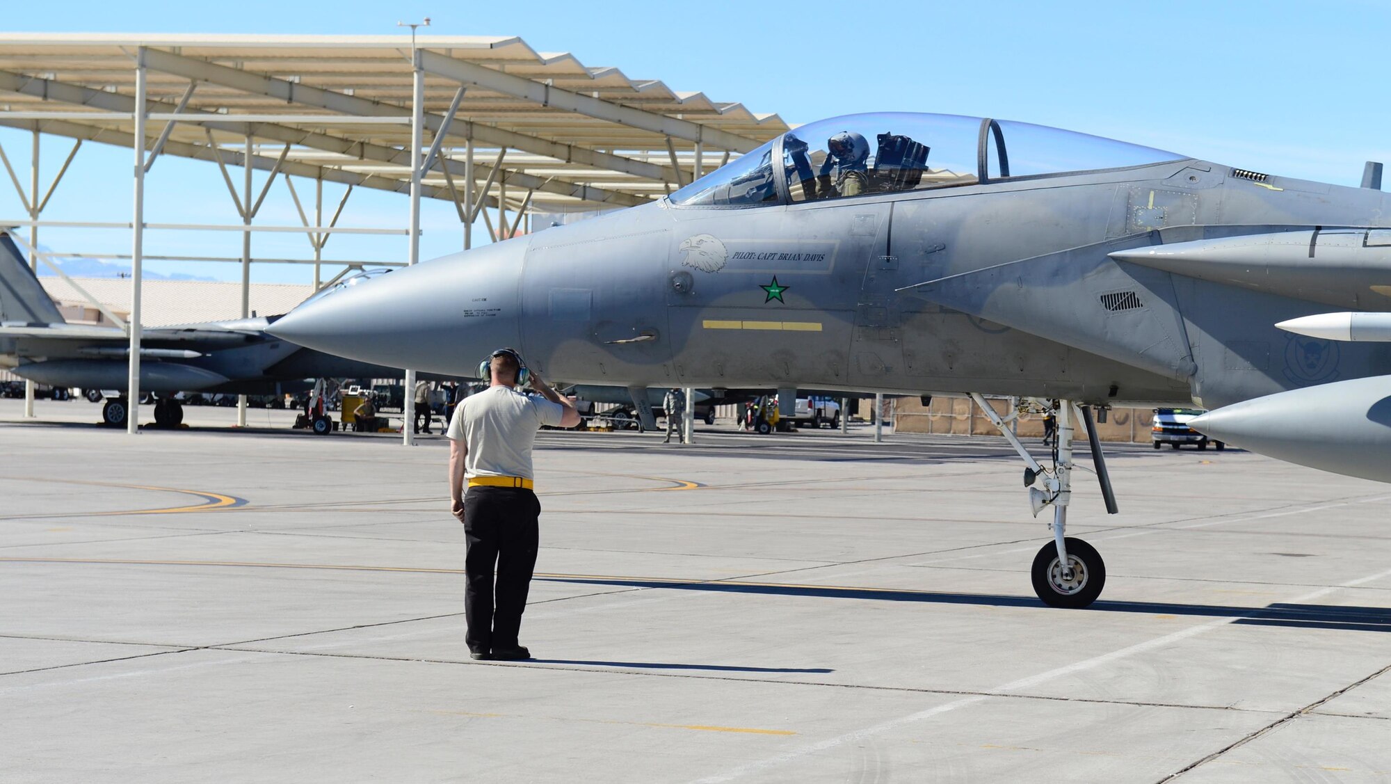 A 493rd Aircraft Maintenance Unit Airman from Royal Air Force Lakenheath, England, marshals out an F-15C Eagle for exercise Red Flag 17-2 at Nellis Air Force Base, Nev., Mar. 3. More than 30 countries have participated directly in a Red Flag exercise. (U.S. Air Force photo/Senior Airman Malcolm Mayfield)