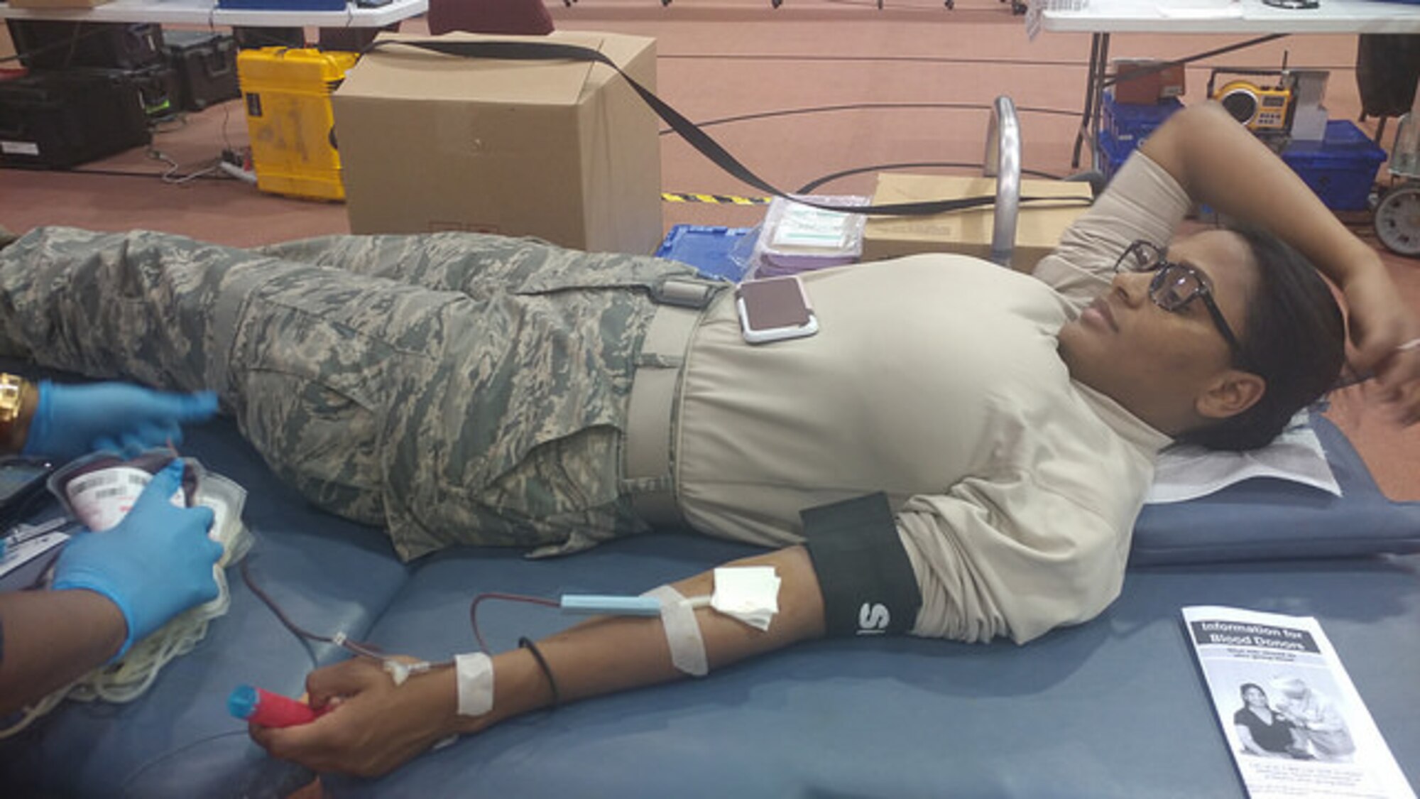Staff Sgt. Rosa Mayi, 514th Air Mobility Wing, gives blood at a blood drive at Tommy B's Activity Center March 6.