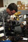 Senior Airman Michael Robinson, 5th Civil Engineer heating, ventilation, air conditioning and refrigeration technician, installs a compressor at Minot Air Force Base, N.D., Feb. 28, 2017. HVAC technicians are responsible for installing, maintaining and repairing furnaces, boilers, stoves, heat-exchanger burners, blowers, fans and radiant heaters. (U.S. Air Force photo/Senior Airman Kristoffer Kaubisch)