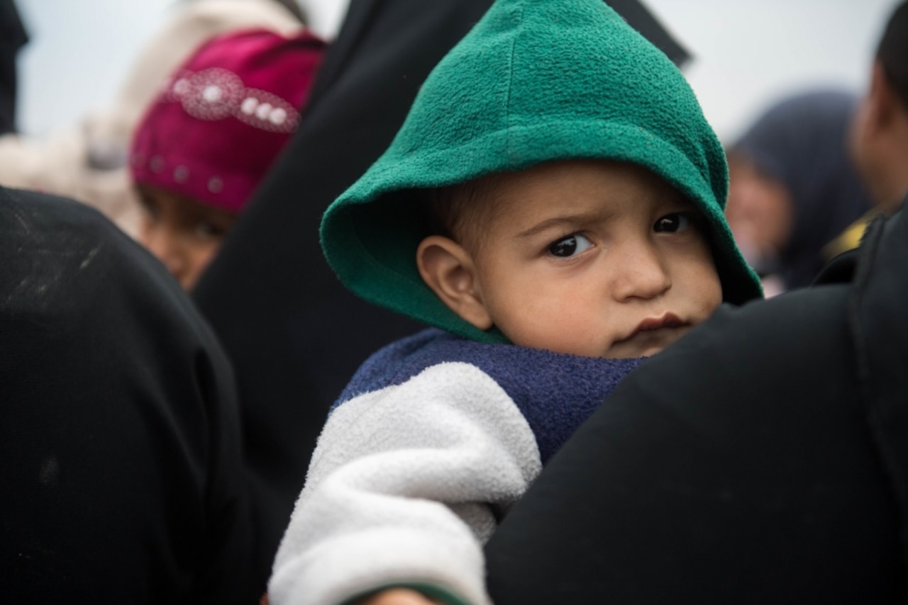 A child waits at a processing station for internally displaced people prior to being transported to refugee camps near Mosul, Iraq, March 3, 2017. Iraqi security forces are continuing operations in the western sector of Iraq’s second-largest city to liberate it from Islamic State of Iraq and Syria control. Army photo by Staff Sgt. Alex Manne