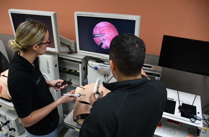 Doctors practice Laparoscopic surgery on a simulated pregnant patient in the Tripler Army Medical Center Simulation Center. The Simulation Center allows hospital staff the opportunity to hone their skills prior to a procedure in order to improve patient services. 