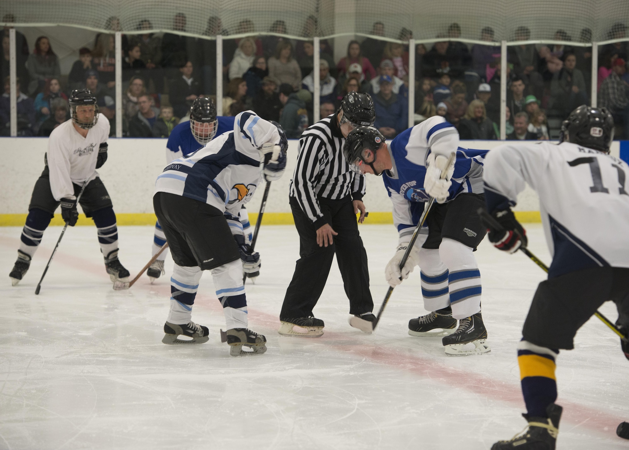 The Dover Eagles and Fraternal Order of Police Lodge 15 hockey teams face off for a charity game March 11, 2017, at the Centre Ice Rink in Harrington, Del. The Eagles won the game 6-4, revenging their 9-7 defeat the year prior. (U.S. Air Force photo by Senior Airman Zachary Cacicia)