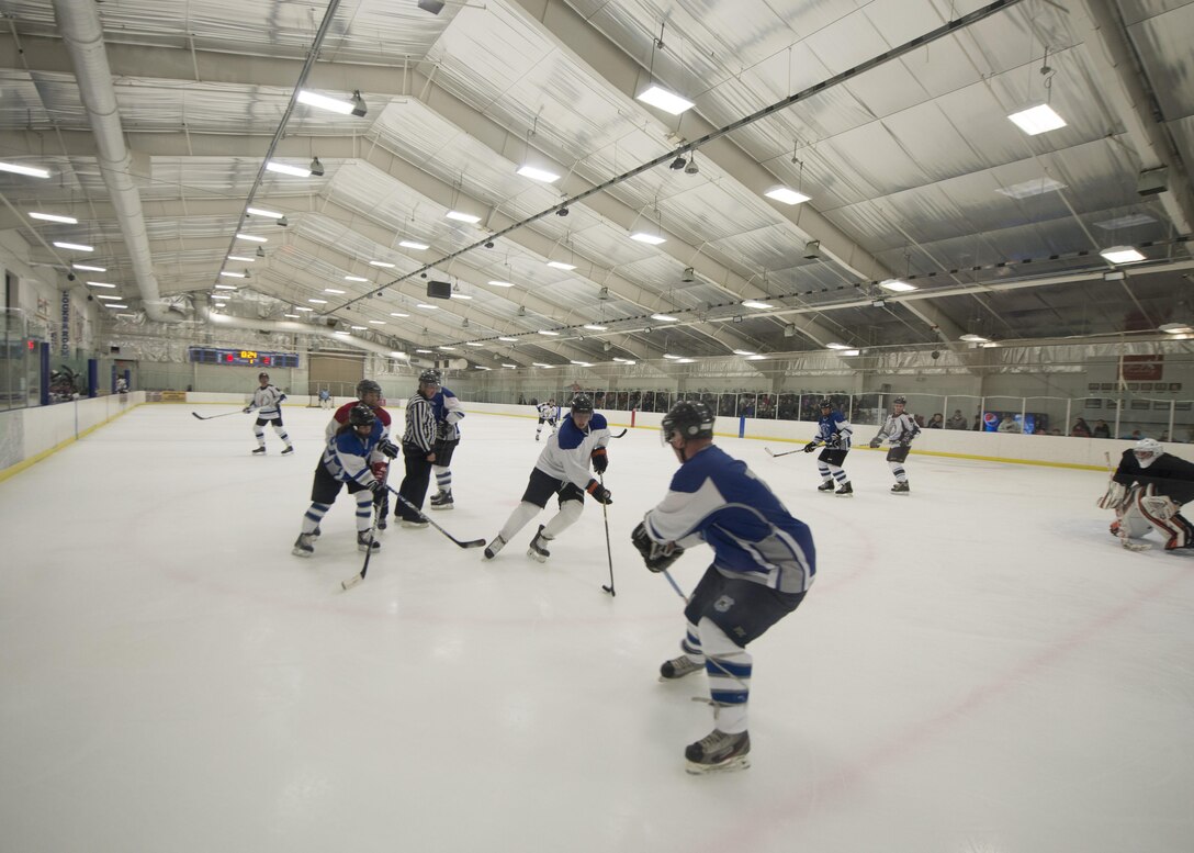 The Dover Eagles and Fraternal Order of Police Lodge 15 hockey teams play against each other during a charity game March 11, 2017, at the Centre Ice Rink in Harrington, Del. The Eagles won the game 6-4. (U.S. Air Force photo by Senior Airman Zachary Cacicia)