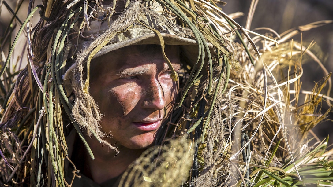 Marine Corps Lance Cpl. William Pearn maneuvers around a training area during a stalking exercise as part of Forest Light 17 at Somagahara, Japan, March 10, 2017. U.S. Marines and Japanese forces conduct the training exercise to demonstrate the enduring commitment by both countries to peace, stability and prosperity across the region. Pearn, a machine gunner in training for scout sniper school, is assigned to Golf Company, 2nd Battalion, 3rd Marine Regiment, 3rd Marine Expeditionary Force. Marine Corps photo by Lance Cpl. Juan C. Bustos