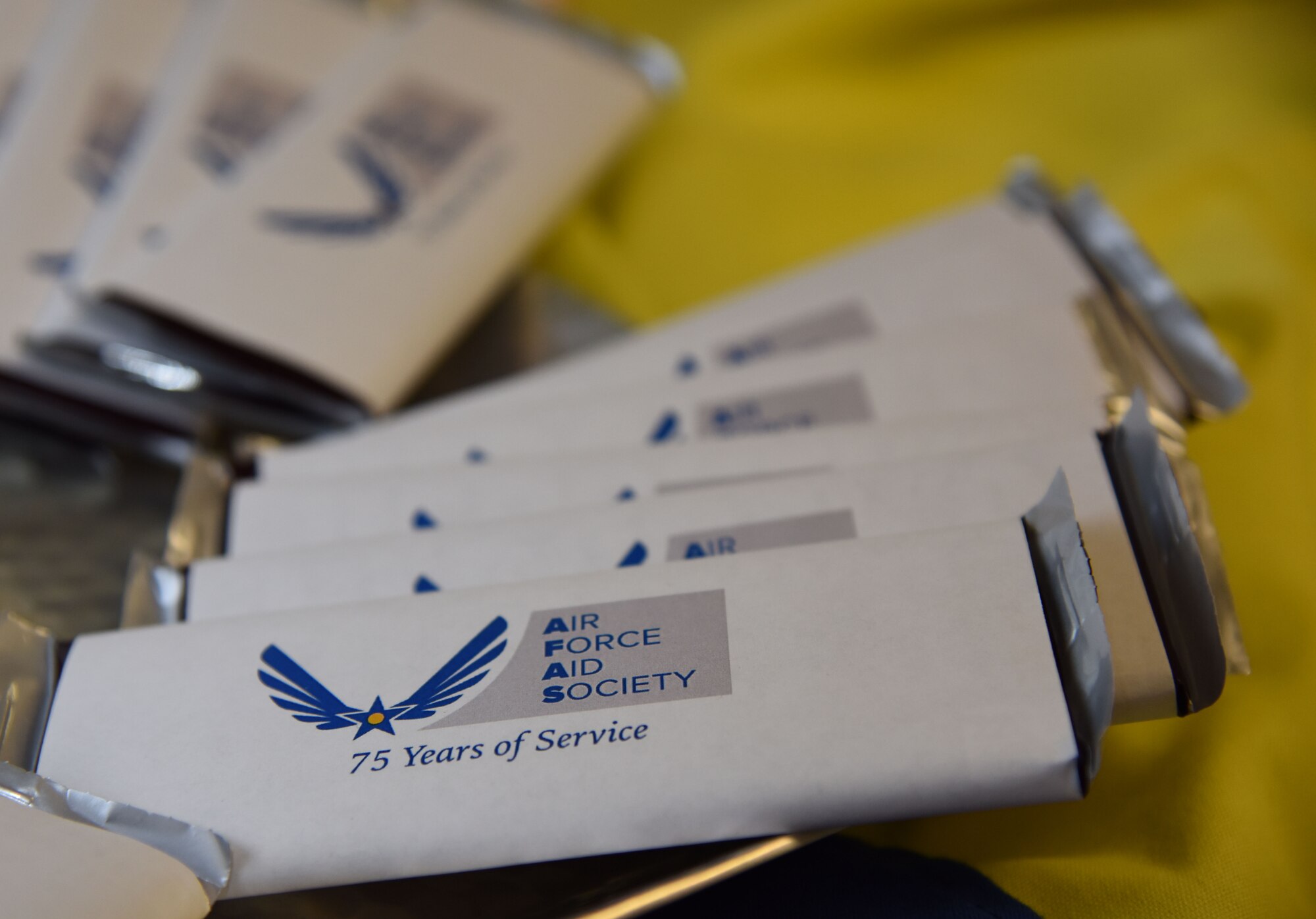 Mementos sit on display during the Air Force Aid Society 75th Anniversary Celebration at the Sablich Center March 10, 2017, on Keesler Air Force Base, Miss. Gen. Henry ‘Hap’ Arnold founded the relief organization in 1942, which is the official charity of the U.S. Air Force and exists to meet the unique needs of Total Force Airmen, their families and widows or widowers. (U.S. Air Force photo by Kemberly Groue)