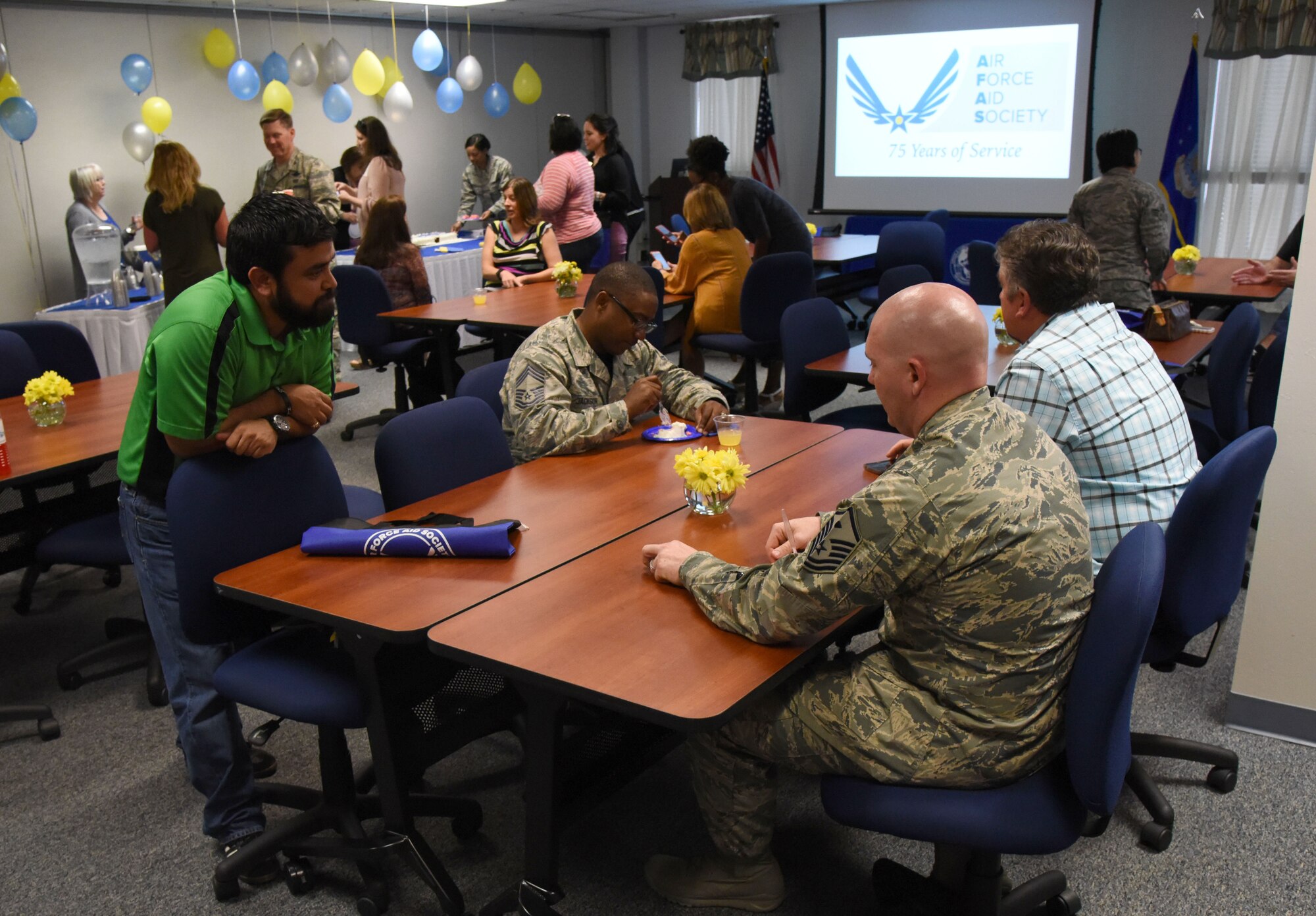 Keesler personnel attend the Air Force Aid Society 75th Anniversary Celebration at the Sablich Center March 10, 2017, on Keesler Air Force Base, Miss. Gen. Henry ‘Hap’ Arnold founded the relief organization in 1942, which is the official charity of the U.S. Air Force and exists to meet the unique needs of Total Force Airmen, their families and widows or widowers. (U.S. Air Force photo by Kemberly Groue)
