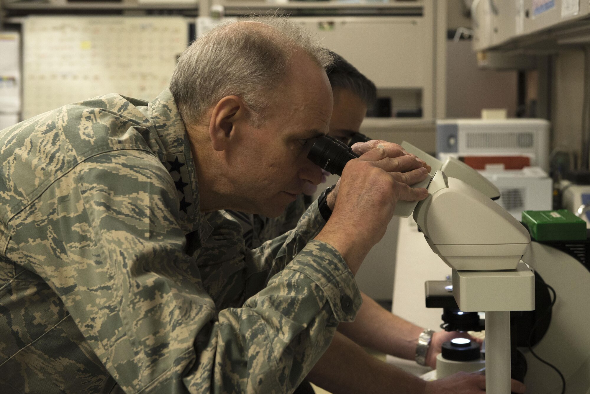 U.S. Air Force Lt. Gen. Mark Ediger, the Air Force surgeon general, observes a parasitic slide through a microscope March 10, 2017 at Eielson Air Force Base, Alaska. Ediger toured the 354th Medical Group facility to gain a better understanding of Eielson’s medical forces and of the challenges presented in its unique environment. (U.S. Air Force photo by Airman Eric M. Fisher)