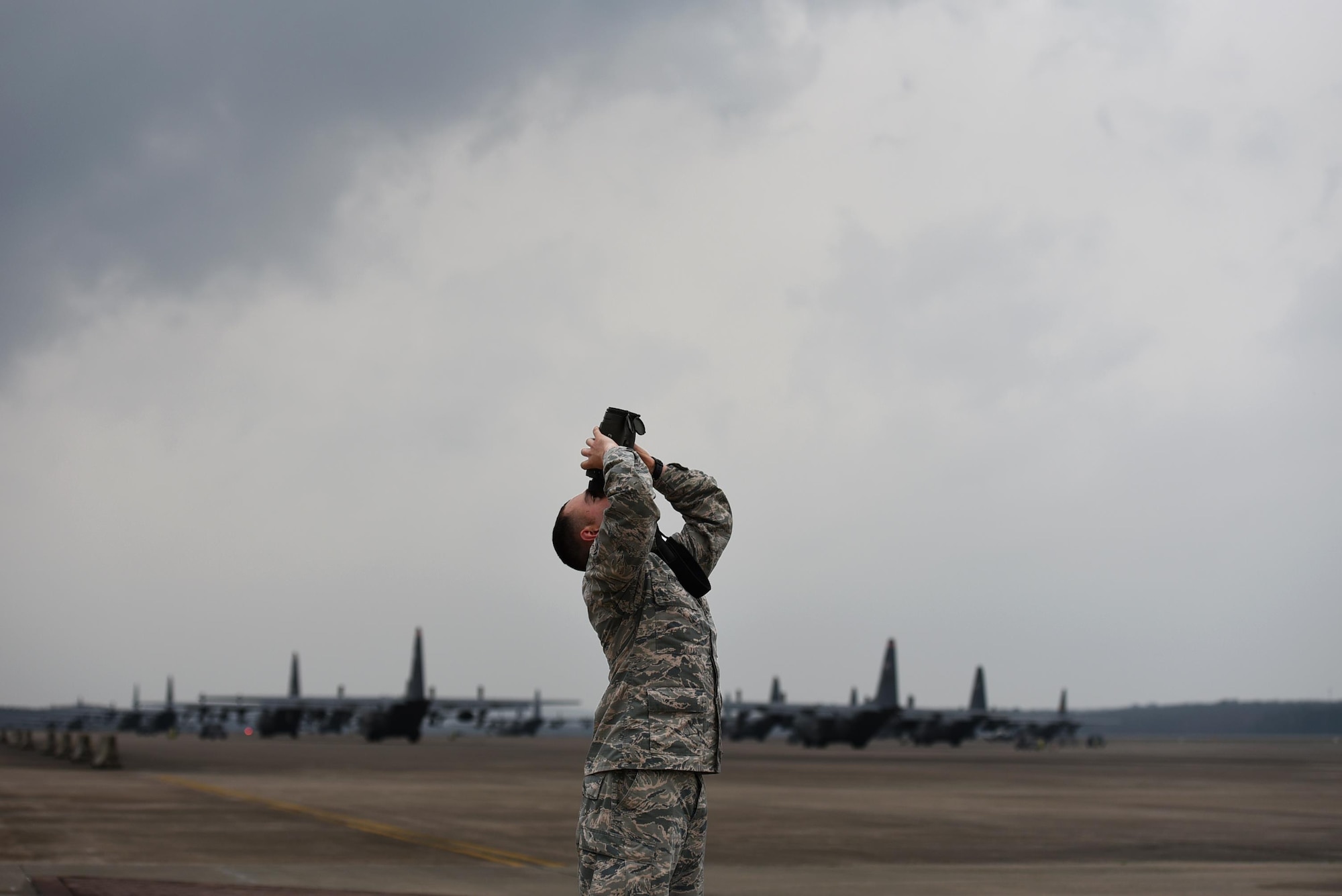 U.S. Air Force Airman 1st Class Jacob Phipps, 19th Operations Support Squadron Weather Flight journeyman, uses a laser range finder during a tornado watch Feb. 28, 2017, at Little Rock Air Force Base, Ark. As meteorologists, Airmen monitor weather patterns 24/7 to alert aircrews and base populace of severe weather conditions imminent in the local area. (U.S. Air Force photo by Airman 1st Class Kevin Sommer Giron)