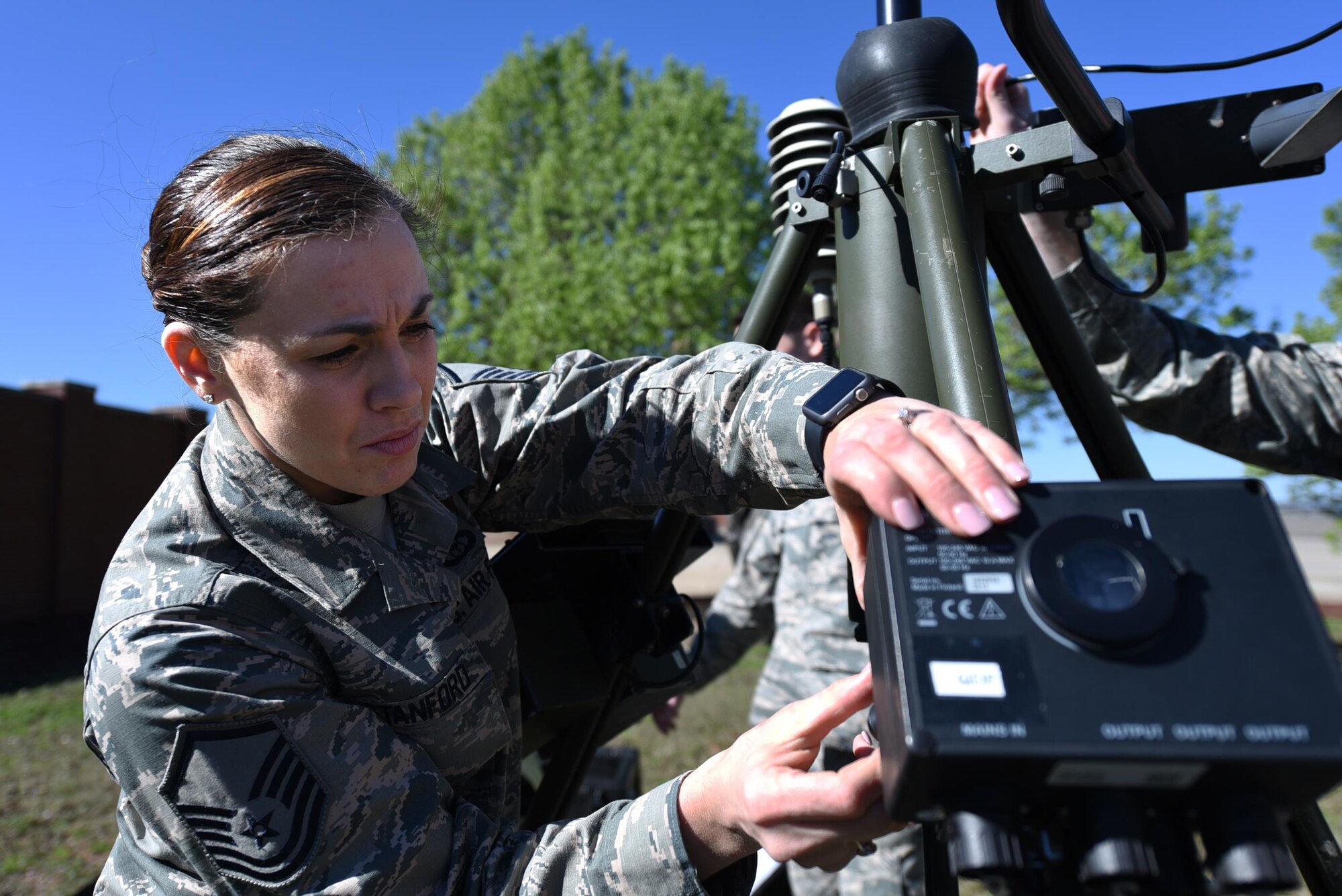 U.S. Air Force Master Sgt. April Stanford, 19th Operations Support Squadron Weather Flight Chief, works on a Tactical Meteorological Observing System March 8, 2017, at Little Rock Air Force Base, Ark. The equipment is a transportable system used in deployed locations to collect essential weather data for ground and flying operations. (U.S. Air Force photo by Airman 1st Class Kevin Sommer Giron)