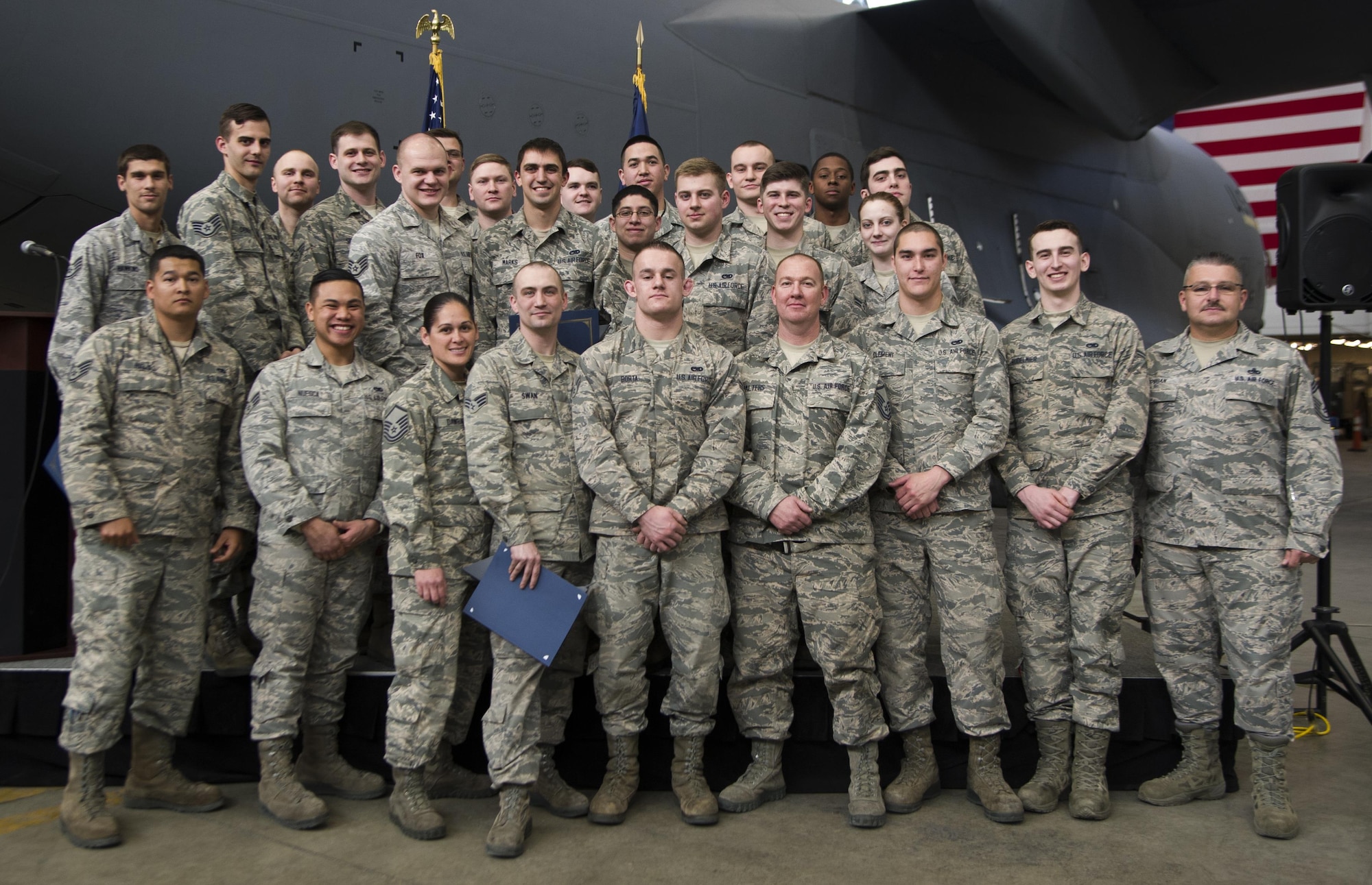 Assistant crew chiefs, dedicated crew chiefs and flying crew chiefs newest member pose for the camera after the recognition ceremony on March 9, 2017 at Joint Base Elmendorf-Richardson, Alaska 