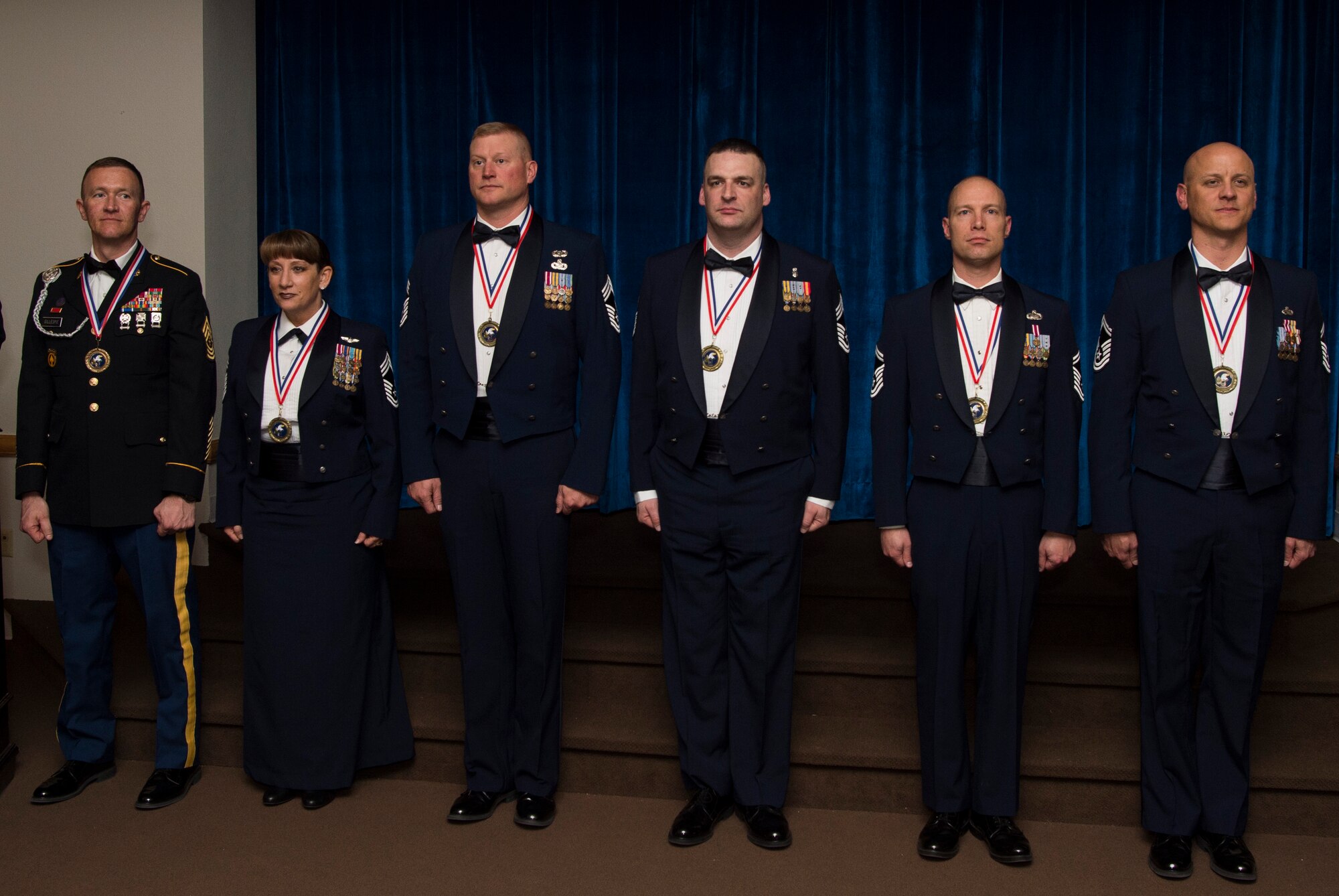 Army and Air Force service members are introduced to the audience at the Trail’s End Event Center during a chief master sergeant and sergeant major induction ceremony on F.E. Warren Air Force Base, March 10, 2017. The induction ceremony recognizes those individuals who have achieved the highest rank in the enlisted force. (U.S. Air Force photo by Staff Sgt. Christopher Ruano)