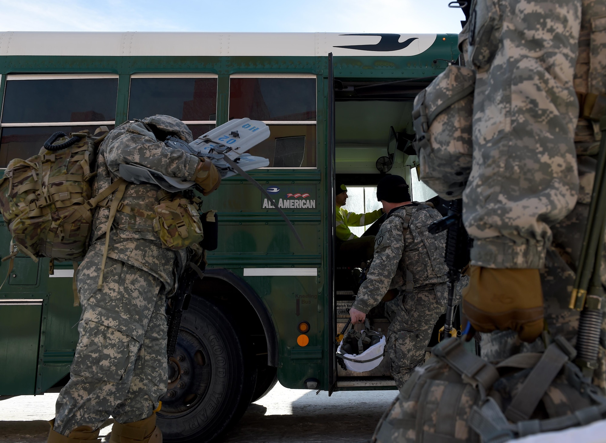 Mark Kieweg, 773d Logistics Readiness Squadron vehicle operator, prepares to depart as Soldiers of the 1st Battalion, 501st Parachute Infantry Regiment, 4th Infantry Brigade Combat Team (Airborne), 25th Infantry Division U.S. Army Alaska load his bus at Joint Base Elmendorf-Richardson, Alaska, March 13, 2017. At JBER, roughly 80 percent of the 773d LRS vehicle operator support is to the Army.
