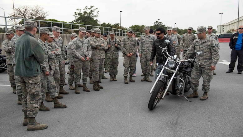 18th Wing Airmen and members of Wing Safety discuss motorcycle maintenance tips and tricks during a pre-ride inspection walkthrough during an 18th Wing annual motorcycle safety brief March 9, 2017, at Kadena Air Base, Japan. Riders of all experience levels came together to talk about motorcycle safety and to practice riding skills on a training course. (U.S. Air Force photo by Staff Sgt. Peter Reft/Released)