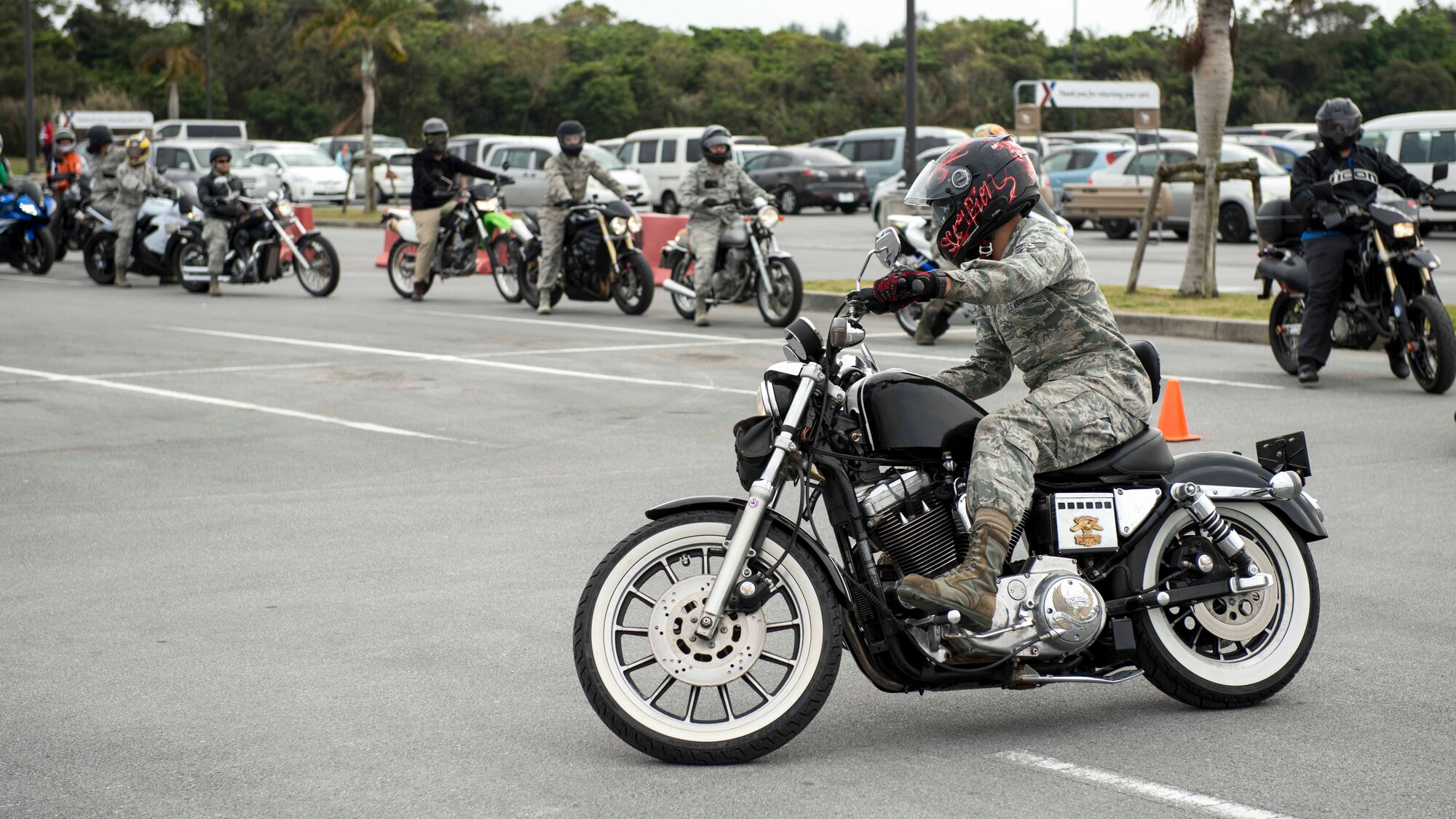 Motorcycle riders refresh their skills on a handling course during an 18th Wing annual motorcycle safety brief March 9, 2017, at Kadena Air Base, Japan. The Green Knights chapter 138 set up a skills test course to help riders improve their bike handling capabilities and to reinforce safety standards. (U.S. Air Force photo by Staff Sgt. Peter Reft/Released)