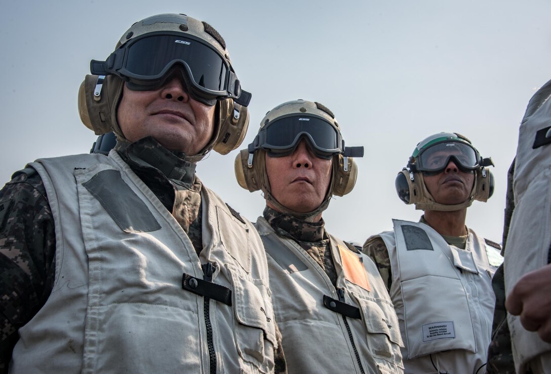 Gen. Vincent K. Brooks, commander, United Nations Command/Combined Forces Command/U.S. Forces Korea, right, Gen. Lee, Sun Jin, chairman of the Republic of Korea Joint Chiefs of Staff, left, and Gen. Leem, Ho-young, deputy commander, Combined Force, Republic of Korea, center, observe flight operations on the aircraft carrier USS Carl Vinson (CVN 70) flight deck, March 12. The Carl Vinson Carrier Strike Group is on a regularly scheduled Western Pacific deployment as part of the U.S. Pacific Fleet-led initiative to extend the command and control functions of U.S. 3rd Fleet. U.S Navy aircraft carrier strike groups have patrolled the Indo-Asia-Pacific regularly and routinely for more than 70 years. (U.S. Navy photo by Mass Communication Specialist 2nd Class Sean M. Castellano/Released)