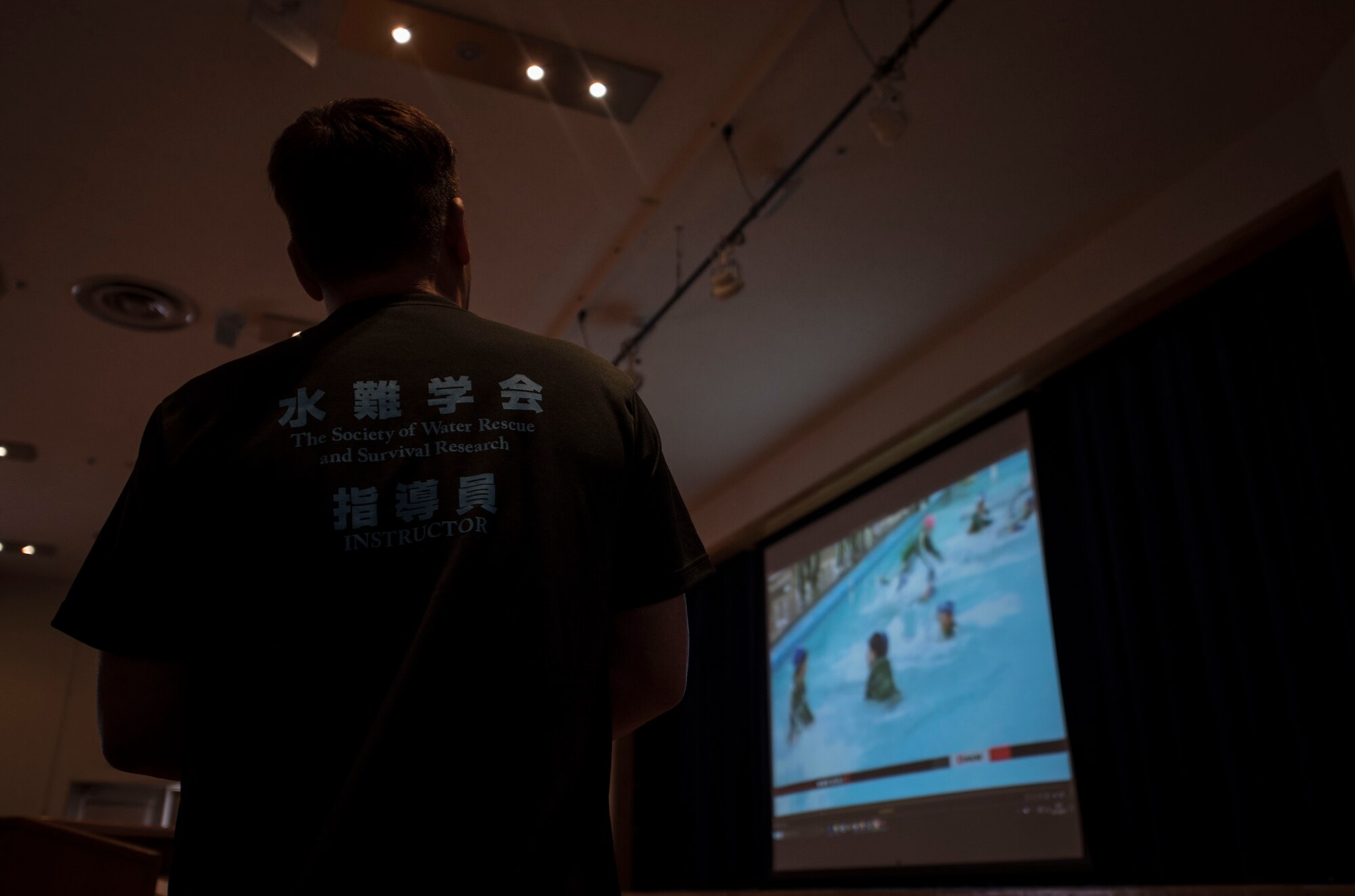 Mr. Jun Abe, a professional diver and Uitemate instructor from Miyagi Prefecture watches a newscast at Misawa Air Base, Japan, March 12, 2017. Abe was a survivor of the 2011 tsunami that struck northern Japan. His team came to the base to teach water survival skills as a way to thank the U.S. military for their assistance during the strongest earthquake to ever strike Japan. (U.S. Air Force photo by Tech. Sgt. Araceli Alarcon)