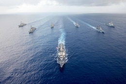 The Arleigh Burke-class guided-missile destroyer USS Mustin (DDG 89) leads U.S. Navy and Japan Maritime Self-Defense Force (JMSDF) ships in formation during MultiSail 17. MultiSail 17 is a bilateral training exercise improving interoperability between the U.S. and Japanese forces.  This exercise benefits from realistic, shared training enhancing our ability to work together to confront any contingency. 