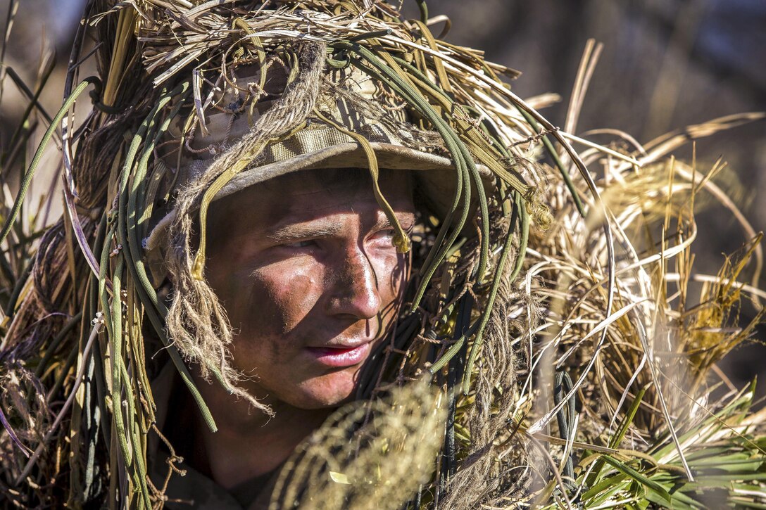 Marine Corps Lance Cpl. William Pearn maneuvers around a training area during a stalking exercise as part of Forest Light 17 at Somagahara, Japan, March 10, 2017. U.S. Marines and Japanese forces conduct the training exercise to demonstrate the enduring commitment by both countries to peace, stability and prosperity across the region. Pearn, a machine gunner in training for scout sniper school, is assigned to Golf Company, 2nd Battalion, 3rd Marine Regiment, 3rd Marine Expeditionary Force. Marine Corps photo by Lance Cpl. Juan C. Bustos